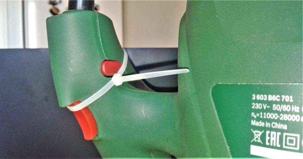 Zip-tie hack for the "on-off" button to stay always in "on" state